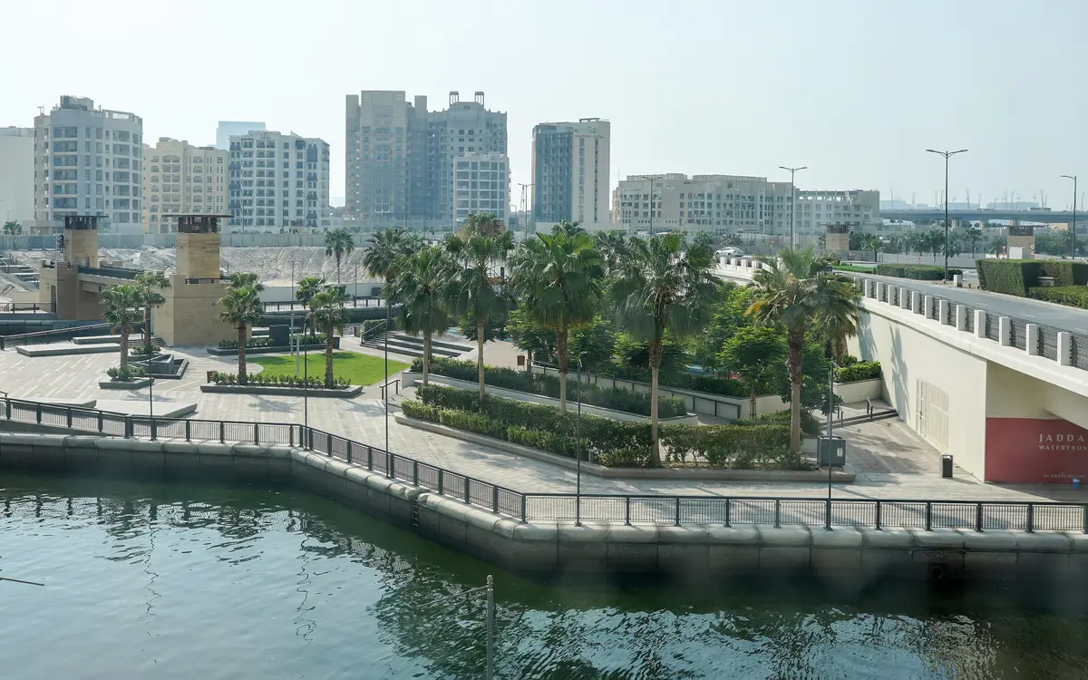 Web design in Dubai: View from Ink Hotel: Exercise park in the coconut grove. Inlet of Dubai Creek, skyline of Jaddaf Waterfront, Dubai, UAE