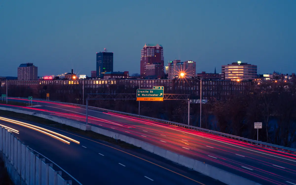 Web design in Manchester: Manchester skyline at night viewed from I-293