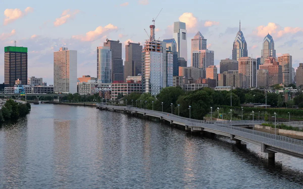 Web design in Philadelphia: Four-segment panorama of Philadelphia skyline, as viewed from the South Street Bridge.